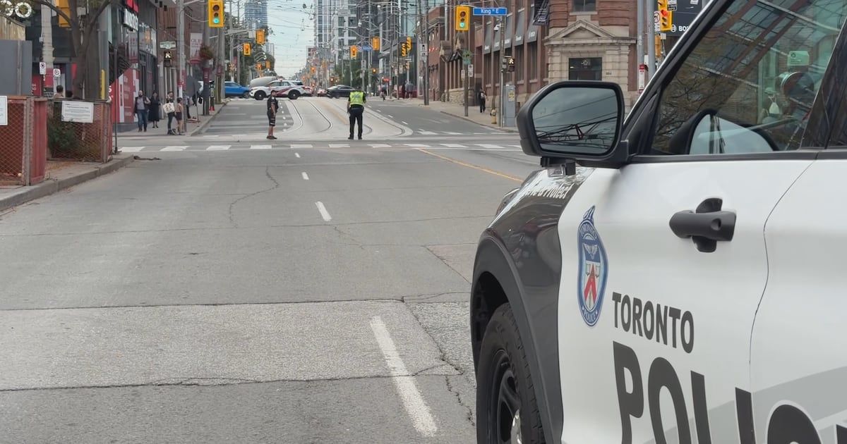 Cyclist transported to hospital after collision with police car in Toronto's Corktown neighborhood