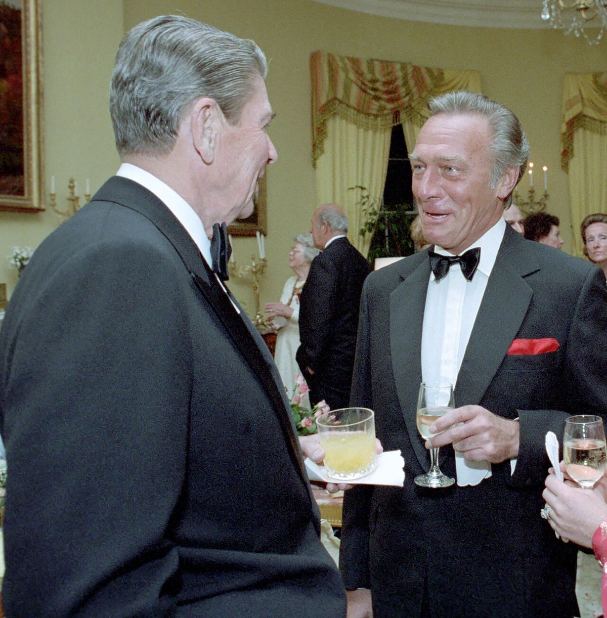 9/30/1985 President talking to actor Christopher Plummer and Elaine Plummer during a Private dinner for Prince Franz Josef II and Princess G