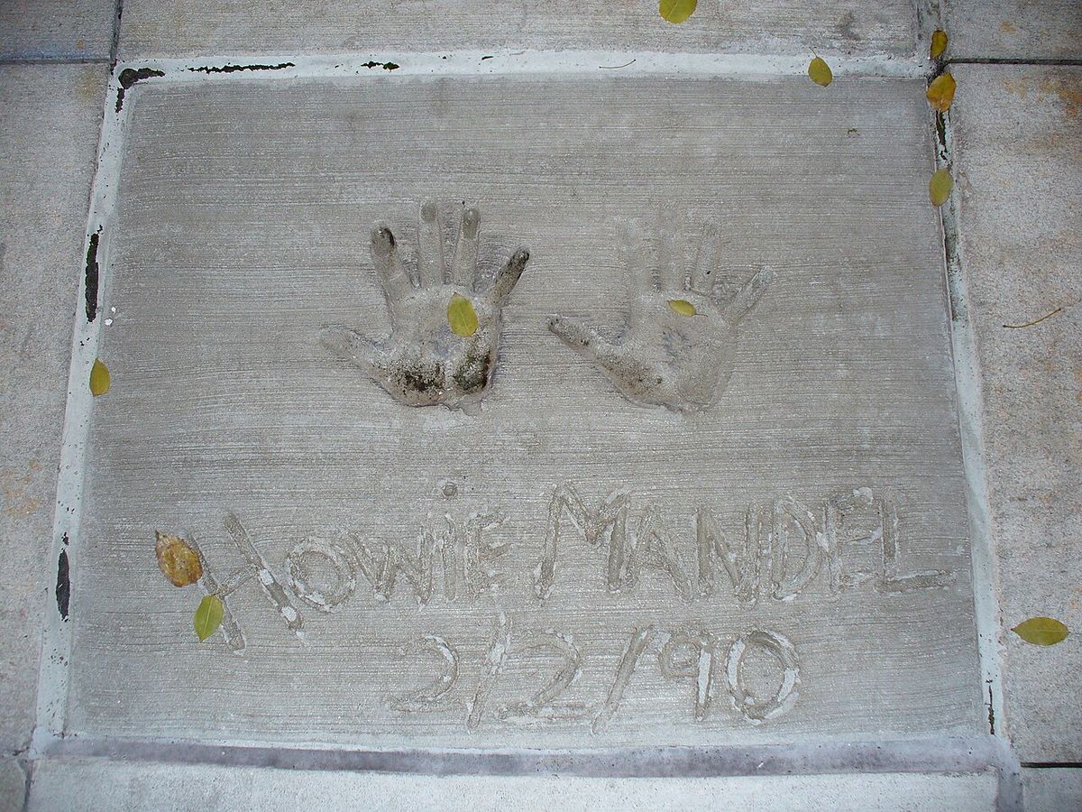 I am the originator of this photo. I hold the copyright. I release it to the public domain. This photo depicts the handprints of Howie Mande