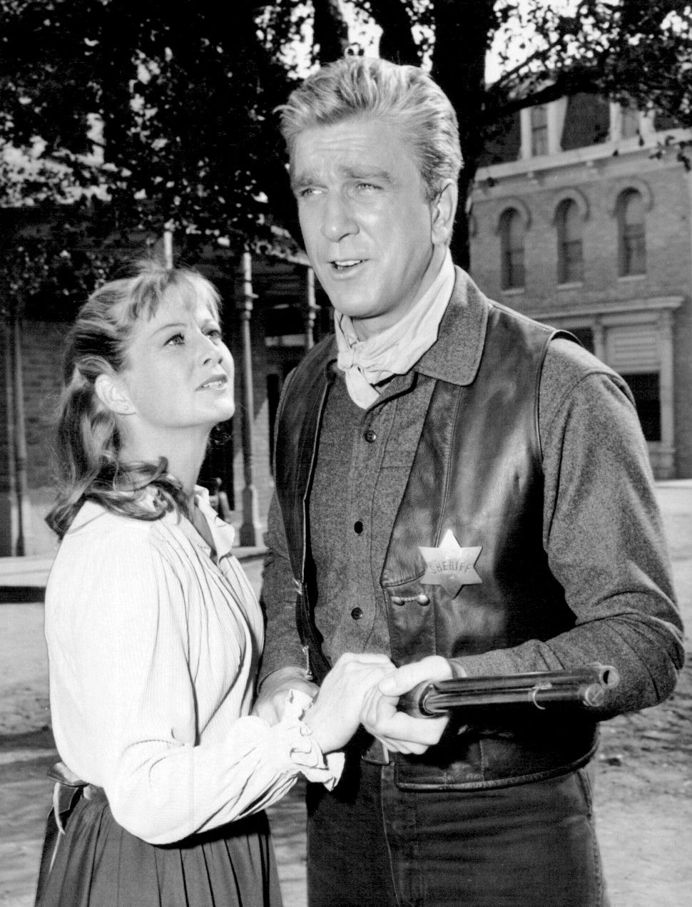 Photo of Leslie Nielsen and Nancy Malone as guest stars on Bonanza.