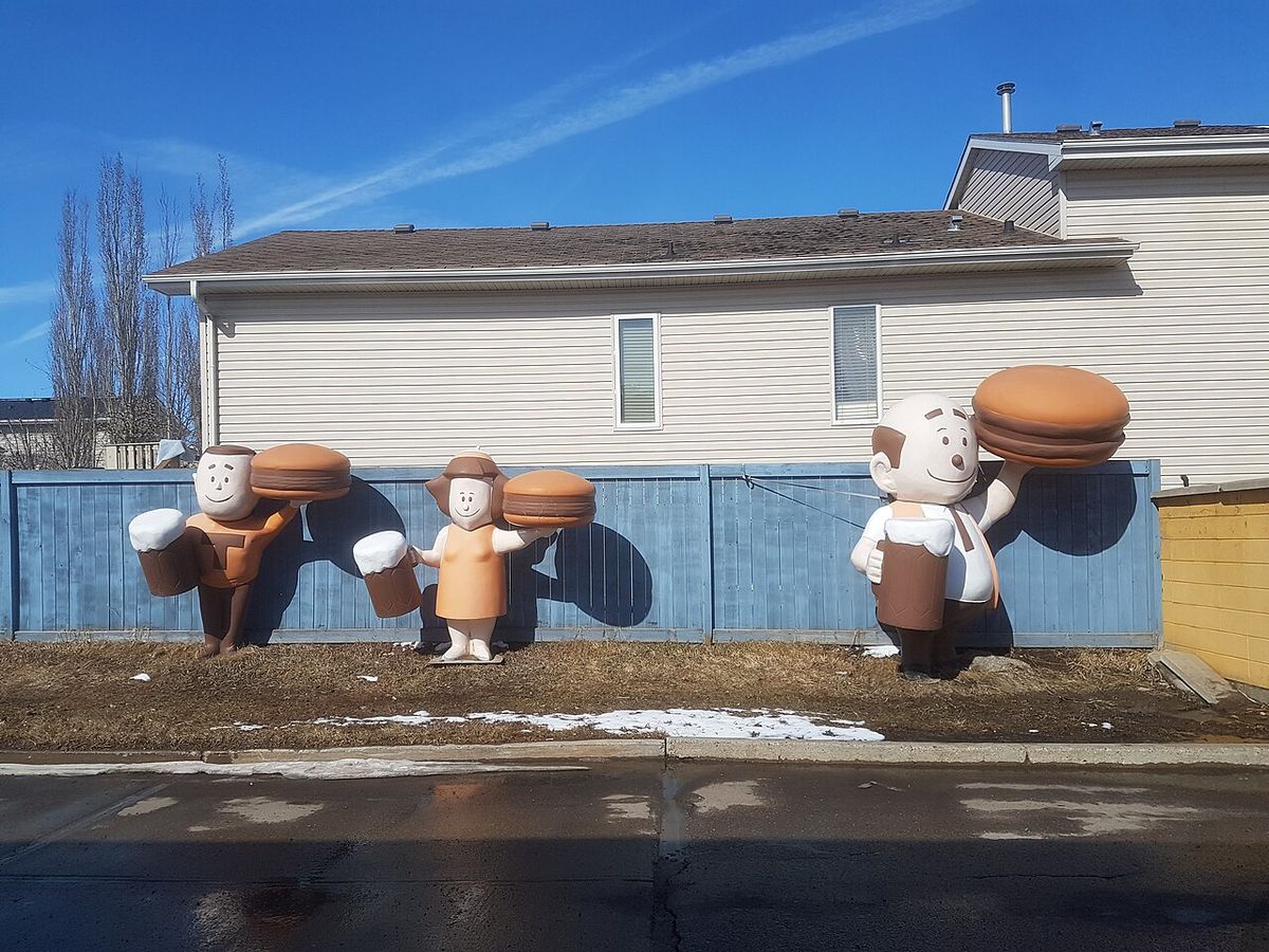 Some "Burger Family" statues outside of an A&W in Morinville, Alberta, Canada in 2022.