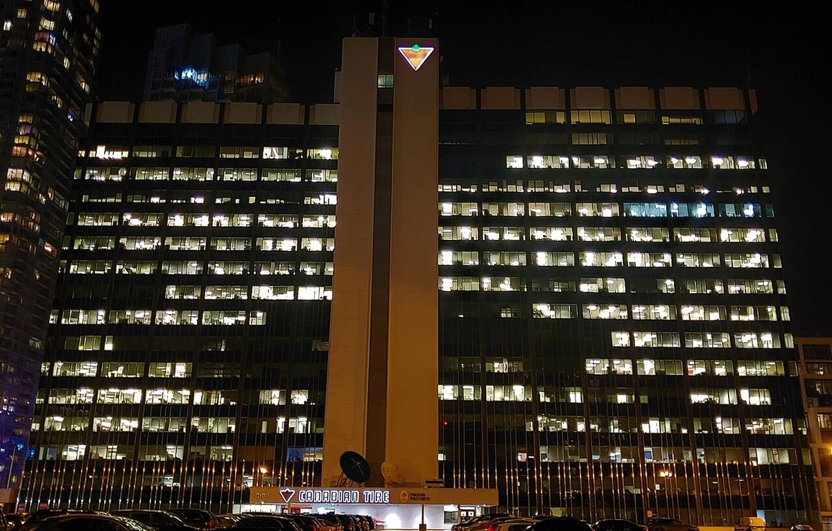 A picture of the Canadian Tire head office taken from the west side of the building on the roof of the parking structure taken at night.