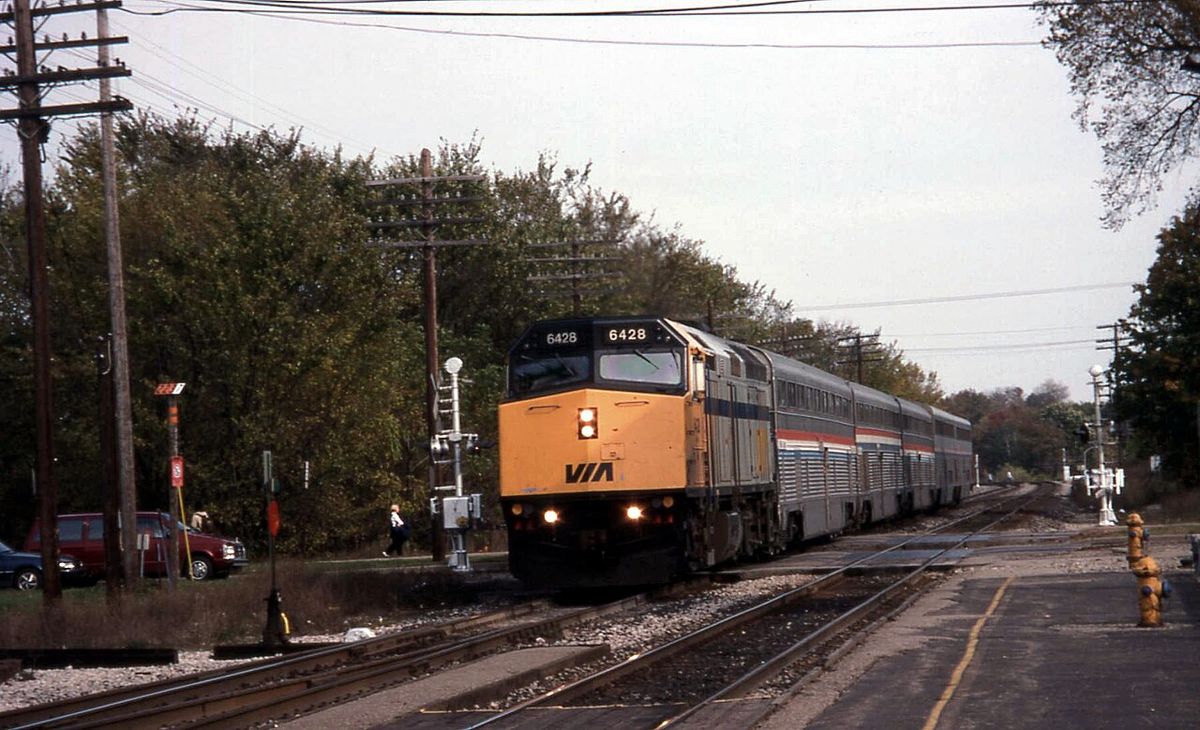 Via Rail #6428, an GMD F40PH-2, leads Amtrak's International Limited into East Lansing, Michigan. The train consists of three ex-ATSF Hi-Lev