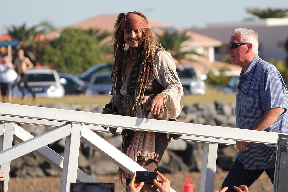 Johnny Depp in full costume returning to land in Cleveland, Queensland after a day of filming for the movie Pirates of the Caribbean: Dead M